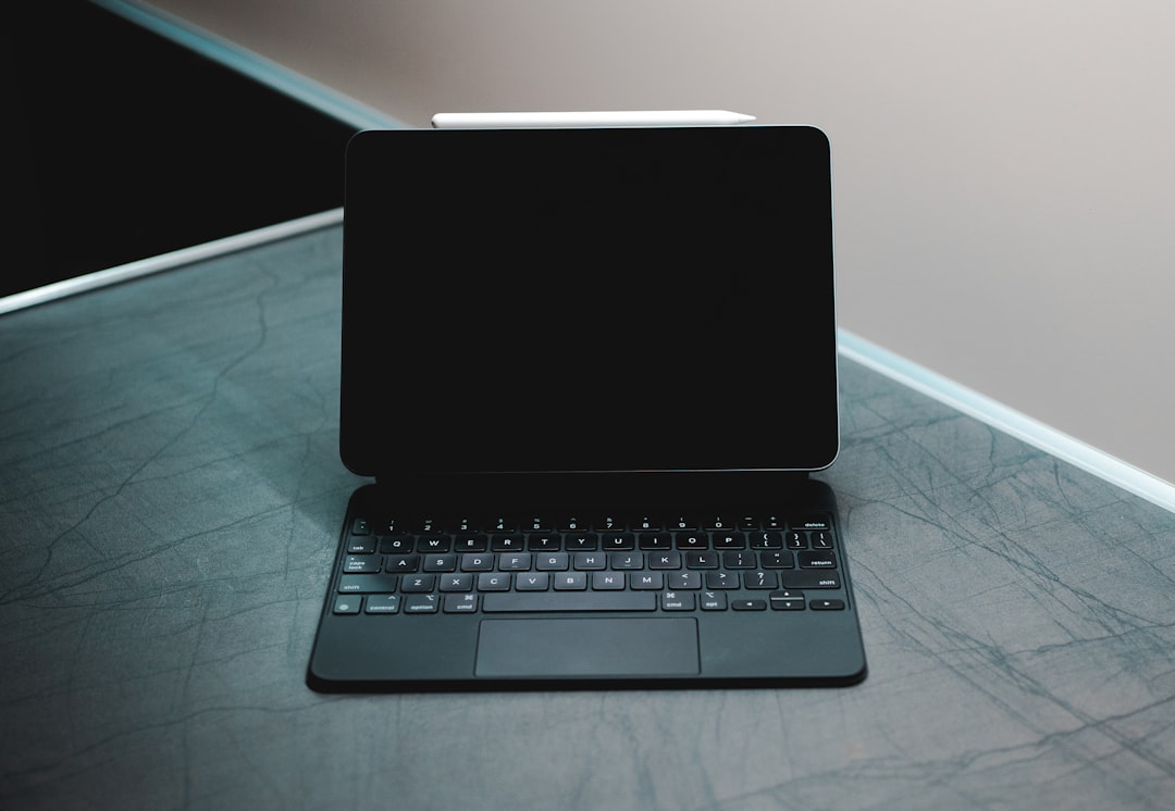A modern laptop with AI-related imagery or data on the screen, representing business applications of artificial intelligence.