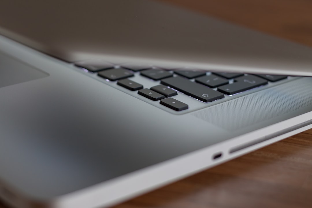 A person happily using a laptop