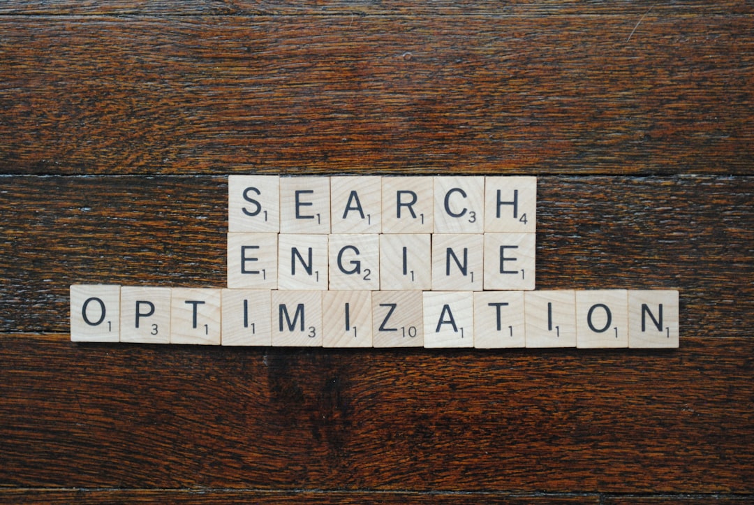 A magnifying glass over search engine results pages related to SEO.