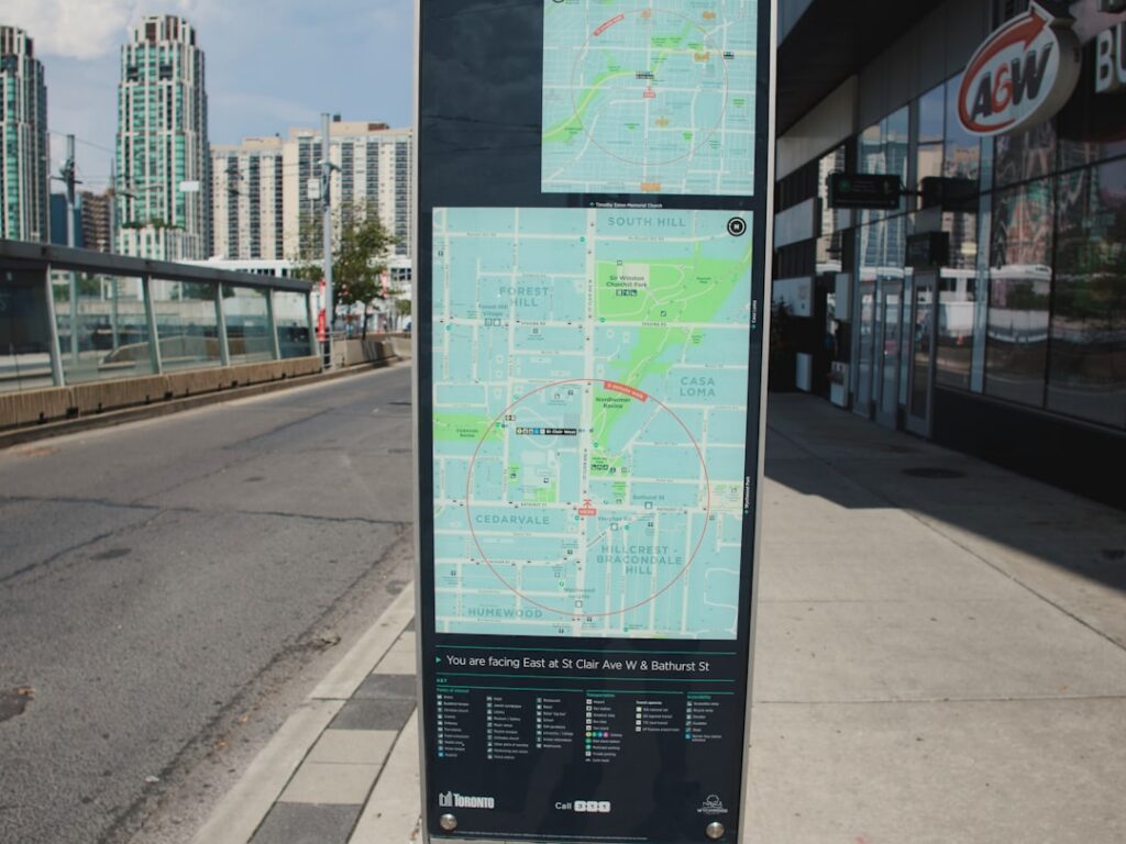 Bright, top-down view of a city map with a magnifying glass focused intently on a specific neighborhood, symbolizing hyper...