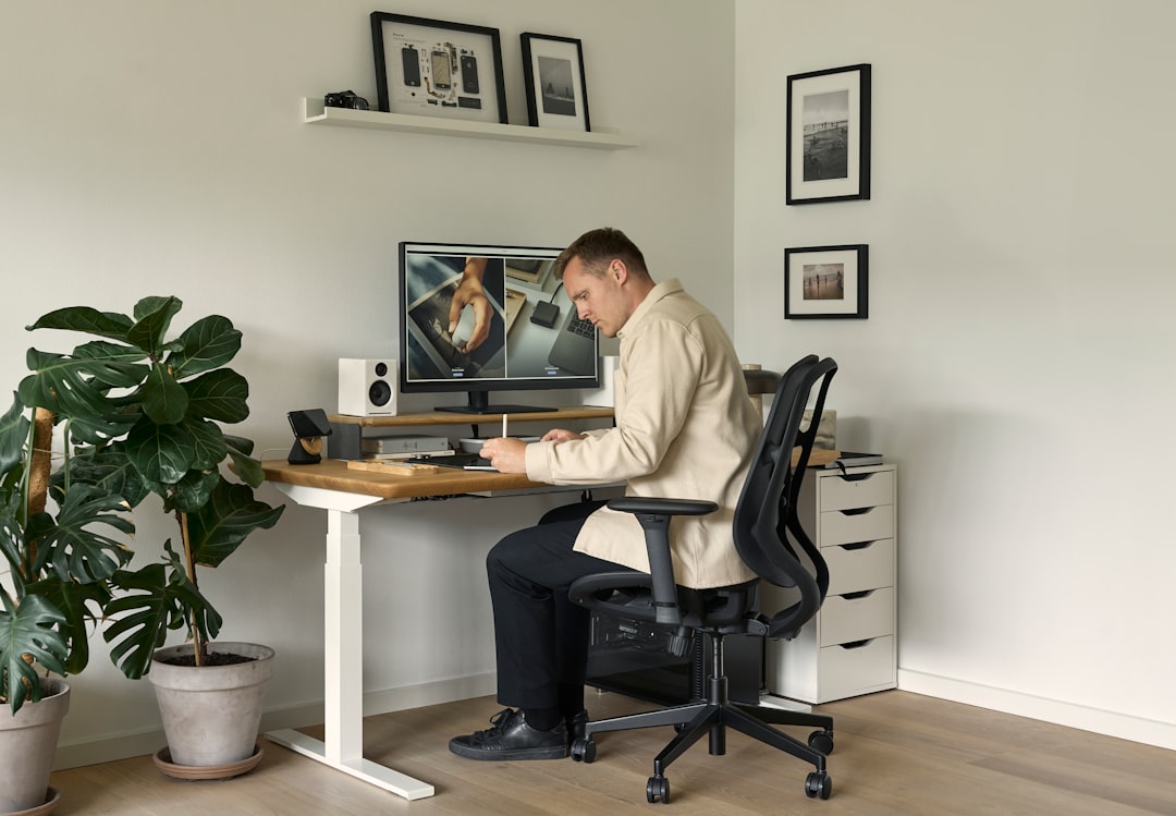 A bright, modern office desk with a laptop open next to a sleek calculator, symbolizing the connection between digital marketing and financial return.
