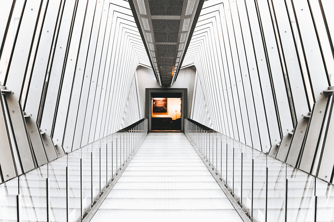 A minimal photo of a modern architectural bridge with strong, clean lines against a bright sky, illustrating how internal links create powerful connections within a website.