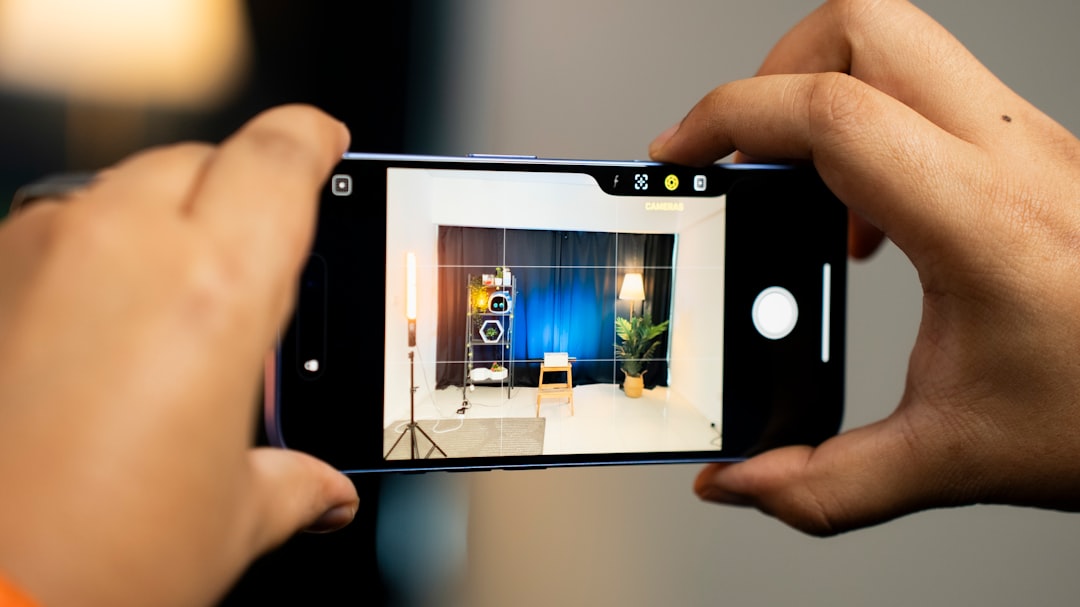 A professional real estate agent using a tablet inside a bright, modern home, illustrating a tech-savvy local business adapting to new search technologies.