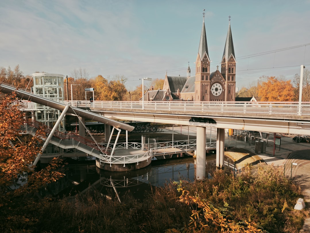 A sleek, modern architectural bridge connects two different landscapes, representing the transition from traditional search to AI-driven search.