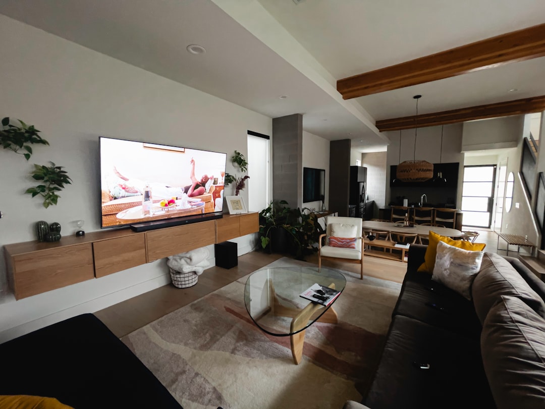 A sleek, modern house with abstract digital lines connecting it to a network, visualizing a strong online foundation and SEO presence for a real estate business.