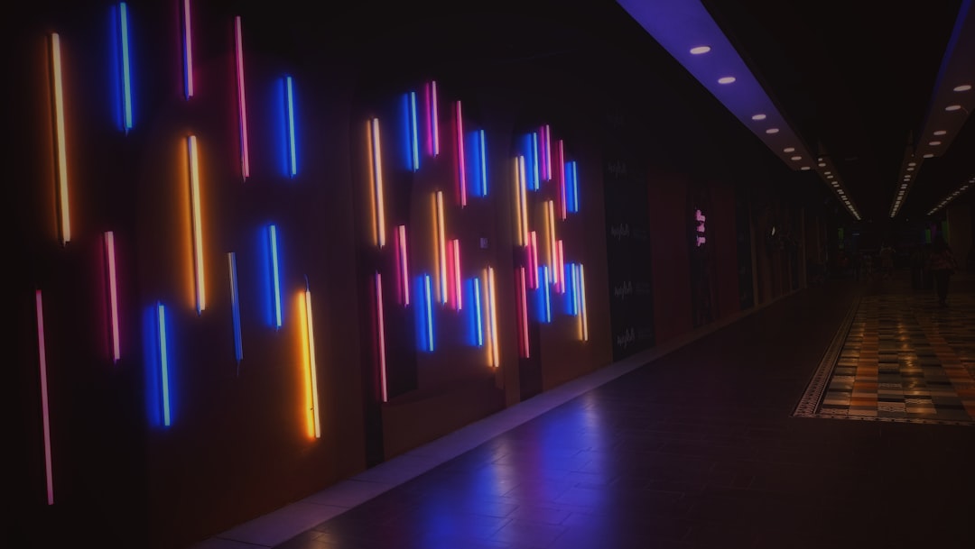 A sleek, modern office interior with a holographic data display in the center, representing the advanced technology changing local business marketing.