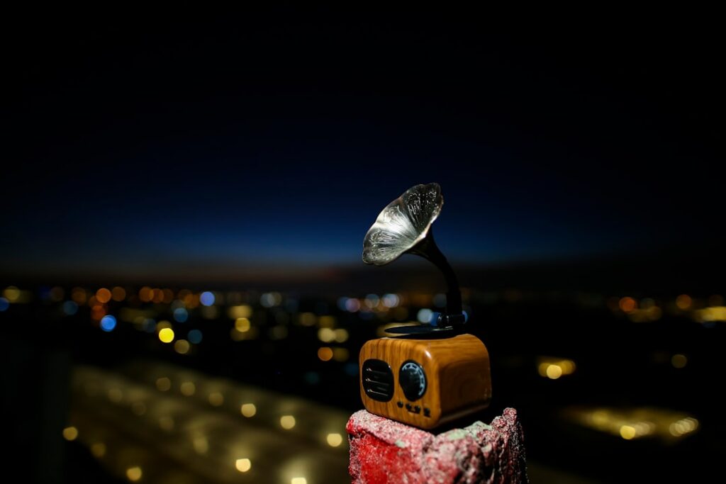 Sleek, modern robotic hand holds a classic, brass navigational compass against a clean, bright background, symbolizing new...